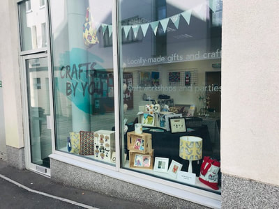 Outside of Crafts By You. Sells handmade gifts and provides craft workshops. 